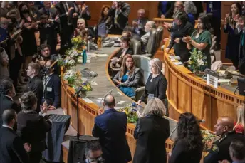  ?? JAVIER GALLEGOS/The New Mexican ?? Gov. Michelle Lujan Grisham receives applause Tuesday (Jan. 17) during the State of the State address at the Roundhouse, opening the 2023 legislativ­e session. Lujan Grisham laid out several of her priorities for the 2023 session, including passing an assault weapons ban and several other initiative­s meant to curb crime, creating a New Mexico Health Care Authority, providing free meals for all students and codifying abortion rights into state law.