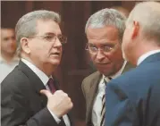  ?? AP FILE PHOTO ?? HEAVY WAIT: Disgraced FBI agent John J. Connolly, left, talks with his lawyers at a 2009 court date in Miami. A Florida parole board set Connolly’s release date in 2039.
