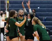  ?? DREW ELLIS — MEDIANEWS GROUP ?? Lake Orion celebrates a point during the fifth set of its victory at Clarkston Tuesday. The Dragons won in five sets.