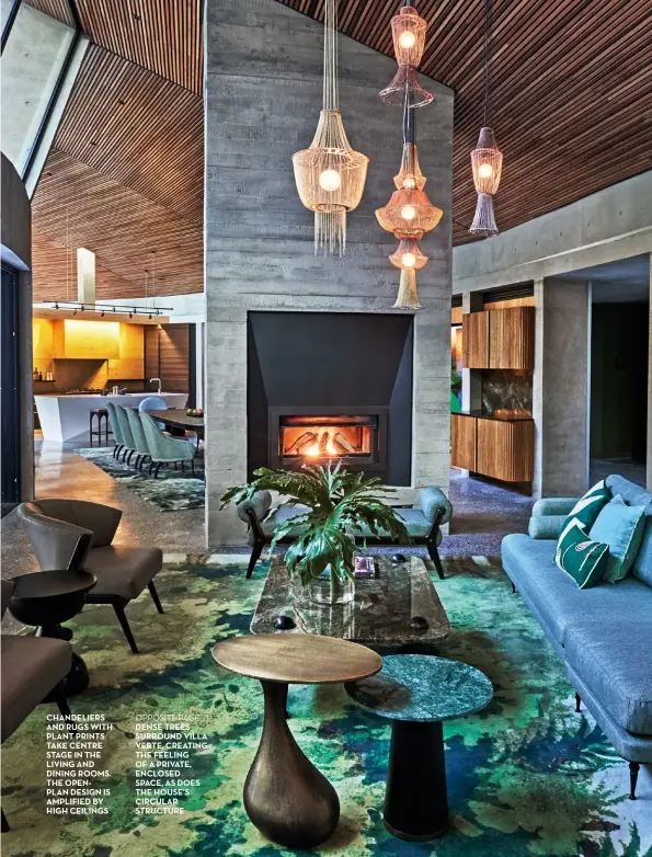  ??  ?? chandelier­s and rugs with plant prints take centre stage in the living and dining rooms. the openplan design is amplified by high ceilings OPPOSITE PAGE dense trees surround villa verte, creating the feeling of a private, enclosed space, as does the house’s circular structure