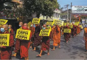  ?? Associated Press ?? Buddhist monks in Mandalay rally to lend their moral authority to the civil disobedien­ce movement that is challengin­g Myanmar’s military rulers.