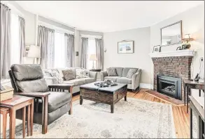  ??  ?? A sitting room with a fireplace in the house at 38 Governors Ave. in Milford.