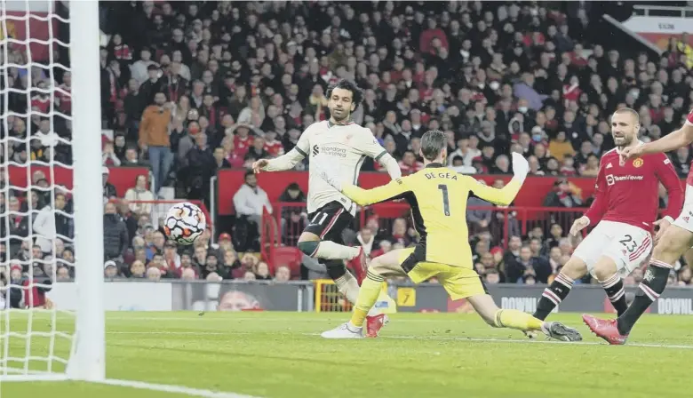  ?? ?? Mohamed Salah scores Liverpool’s fifth goal, completing his hat-trick, in the Merseyside club's biggest ever win at Old Trafford. Inset below, Paul Pogba fouls Naby Keita leading to a red card for the Manchester United midfielder