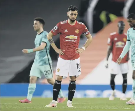  ??  ?? Manchester United’s Bruno Fernandes stands dejected after Liverpool wrap up the win at Old Trafford.