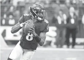  ?? EVAN HABEEB/USA TODAY SPORTS ?? Lamar Jackson looks to throw in the fourth quarter Nov. 17 against the Texans.