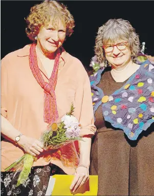  ?? MITCH MACDONALD/THE GUARDIAN ?? Island author Louise Burley, left, accepts the Susan Buchanan Creative Non-Fiction Award from Laurie Brinklow, co-ordinator of UPEI’s Institute of Island Studies, during the 30th Cox and Palmer Island Literary Awards held at The Mack on Saturday. The...