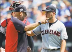  ?? Colin E. Braley / Associated Press ?? Cleveland manager Terry Francona, left, has words with pitcher Trevor Bauer, right, as Bauer is taken out in the fifth inning against the Kansas City Royals at Kauffman Stadium in Kansas City, Mo., on July 28. Francona said Sunday that he believes the Indians need to change their name. “I think it’s time to move forward,” Francona said.