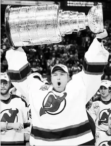  ?? ASSOCIATED PRESS FILE PHOTO ?? New Jersey goalie Martin Brodeur hoists the Stanley Cup after the Devils defeated the Anaheim Mighty Ducks in East Rutherford, N.J., in 2003. Brodeur was selected to the Hockey Hall of Fame on Tuesday.