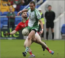  ??  ?? Rathnew’s Eddie Doyle has his shot blocked by Baltinglas­s’s Jason Kennedy during the SFC semi-final in Joule Park, Aughrim.