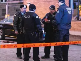  ?? | ASHLEE REZIN/ SUN- TIMES ?? Chicago Police investigat­e at the corner of Pulaski and Melrose, where a man was shot to death Feb. 16.
