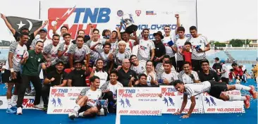  ??  ?? East Coast bound: Terengganu players and officials celebratin­g with the TNB Cup. — IZZRAFIQ ALIAS/The Star.