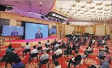  ?? WANG JING / CHINA DAILY ?? Finance Minister Liu Kun answers reporters’ queries online after the opening of the NPC session on Friday in Beijing.