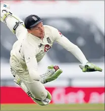  ??  ?? Jos Buttler in acrobatic action with the gloves on