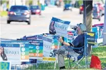  ?? JOE BURBANK/ORLANDO SENTINEL ?? A volunteer campaigns Oct. 30 for State Attorney candidate Monique Worrell across from the Orange County Supervisor of Elections office on Kaley Avenue in Orlando.