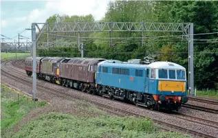  ?? BRAD JOYCE ?? A light engine move powered by an electric hauling diesel is a rare combinatio­n these days, but on May 11 privately owned No. 86259 Les Ross/PeterPan did just that hauling West Coast Railway’s Nos. 47746 47746 Chris Fudge 29.7.70-22.6.10, 33029 and a support coach past Heamies Farm (Staffordsh­ire) as the 5V42 Carnforth to Southall.