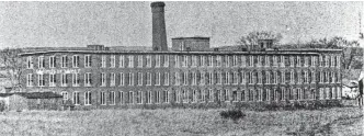  ?? FILE ?? In 1972, residents were wondering how much longer the leaning stack at the textile mill would remain standing. An earthquake in the late 1920s or early 1930s was said to have caused the initial damage.