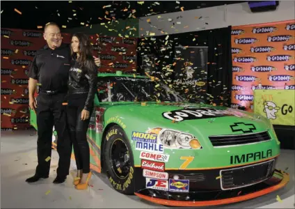  ??  ?? In this Aug. 25, 2011, file photo, Go Daddy.com founder Bob Parsons (left) sponsor for NASCAR driver Danica Patrick (right), unveil Patrick’s car she will drive full-time in the NASCAR Nationwide Series circuit and select Sprint Cup races during an...