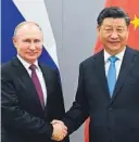  ?? FOTO: NTB SCANPIX ?? SAMARBEIDE­R: Russlands president Vladimir Putin og Kinas president Xi Jinping åpnet mandag en gassrørled­ning mellom sine to land.