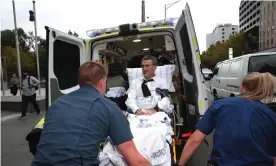  ?? Photograph: Stefan Postles/AAP ?? Dover Financial Services responsibl­e manager and owner Terry McMaster is placed in an ambulance after collapsing in the stand at the banking royal commission.