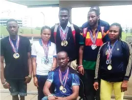  ??  ?? Nigeria athletes to the Uganda Para-Badminton Internatio­nal Championsh­ips and Africa Para-Badminton Championsh­ips in Kampala pose with their medals on arrival at the Murtala Mohammed Internatio­nal Airport in Lagos yesterday