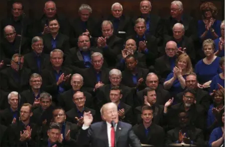  ?? CAROLYN KASTER — THE ASSOCIATED PRESS ?? Members of the First Baptist Dallas Church Choir are seated behind President Donald Trump as he speaks during the Celebrate Freedom event at the Kennedy Center for the Performing Arts in Washington, Saturday.