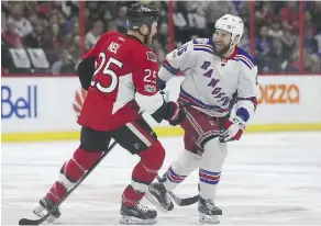  ?? TONY CALDWELL ?? Ottawa Senators right wing Chris Neil and New York Rangers left wing Tanner Glass helped make Game 5 of their series a more physical affair than in Games 1 and 2, when neither were in the lineup.