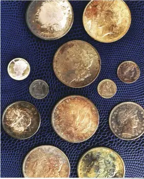  ??  ?? These coins have all had chemicals added to their surfaces and are “doctored.” Over time, they can be expected to turn much less attractive colors.