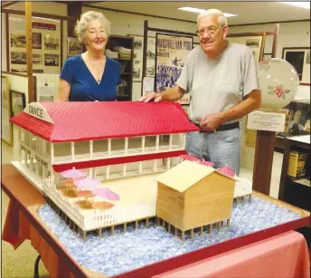  ?? ?? Carole Harter and Heezen stand with the Dance Pavilion model that Gene built and donated to the Bella Vista Historical Museum in 2014.