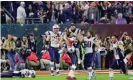  ??  ?? Julian Edelman celebrates with Tom Brady after the Patriots’ incredible comeback victory in Super Bowl 51. Photograph: Jamie Squire/Getty Images