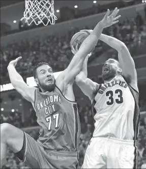  ?? BRANDON DILL / AP ?? Memphis Grizzlies center Marc Gasol shoots over Oklahoma City Thunder counterpar­t Joffrey Lauvergne in the second half of Thursday’s NBA clash in Memphis, Tennessee.