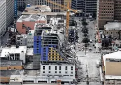  ?? AP ?? This aerial photo shows the Hard Rock Hotel, which was under constructi­on, after a fatal partial collapse in New Orleans on Saturday. The bodies of two people killed have not been recovered. Thirty people were injured.