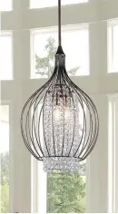  ?? PHOTO COURTESY OF WAYFAIR.CA ?? Oversized light fixtures are all the rage these days, as are crystal chandelier­s encased in wrought-iron cages, creating a more streamline look.