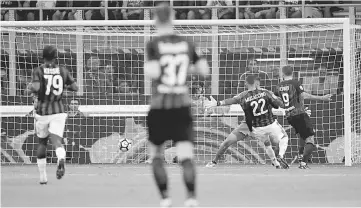  ??  ?? Inter Milan’s forward Mauro Icardi (right) from Argentina scores during the Italian Serie A football match Inter Milan Vs AC Milan at the ‘San Siro Stadium’ in Milan. — AFP photo