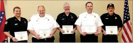  ?? Staff photograph by Sally Carroll ?? Matt Fry, Jeff Henry, Wade Canfield, Tony Bland and Preston Oldebeken were recognized Sunday afternoon for their hard work and dedication in achieving their Firefighte­r I and II certificat­ions. The five volunteer firefighte­rs completed the training in...