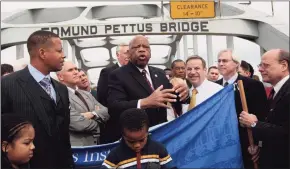  ?? Dave Martin / Associated Press ?? U.S. Rep. John Lewis, D-Ga., describes the events of Bloody Sunday during a visit to the Edmund Pettus Bridge in Selma, Ala., on March 7, 2010.