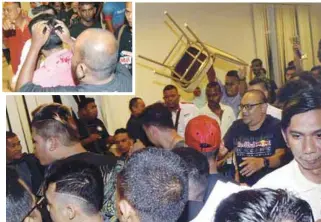  ??  ?? A member throwing a chair during the fracas at Safira Country Club, Seberang Jaya. (Inset): A PKR member being attended to after he was injured on his head.