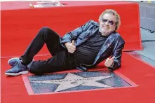  ?? Kevin Winter/Getty Images ?? Sammy Hagar poses with his star — which he calls “way beyond a dream” — during his Hollywood Walk of Fame ceremony.