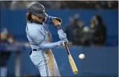  ?? FRANK GUNN — THE CANADIAN PRESS ?? Toronto Blue Jays shortstop Bo Bichette (11) hits the game winning solo home run during the eighth inning against the New York Yankees on Wednesday.