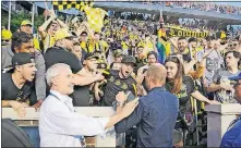  ?? [ADAM CAIRNS/DISPATCH] ?? Crew coach Gregg Berhalter talks with his team’s supporters following a 1-0 loss to FC Cincinnati.