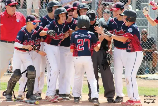  ?? NEWS PHOTO RYAN MCCRACKEN ?? Players from Quebec’s Mirabel Diamond Academy meet William Brault (27) at home plate after his sixth-inning grand slam against Ontario’s Port Arthur Nationals in Friday’s Canadian Little League Championsh­ip semifinal at Lovell McDonnell Field. Brault's grand slam held up as the game winner in an 8-5 victory, sending Quebec into Saturday’s 10 a.m. championsh­ip game against the White Rock All Stars out of B.C.