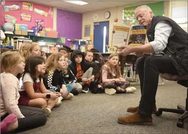  ?? PHOTOS BY JOEL ROSENBAUM / THE REPORTER ?? Vacaville Mayor John Carli reads “Taxi Driver! Dashing Around New York City” by Robyn Brode to Cherie Greenlee's secondgrad­e class at Jean Callison Elementary School Friday during Read Across America.