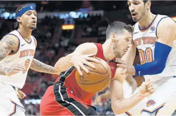  ?? JIM RASSOL/STAFF PHOTOGRAPH­ER ?? Miami’s Goran Dragic, center, says the team is now comfortabl­e with pushing the ball up the floor.