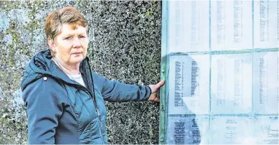 ?? PHOTO: ANDY NEWMAN ?? Mass grave: Historian Catherine Corless with the list of children’s names at the Tuam Mother and Babies Home site.