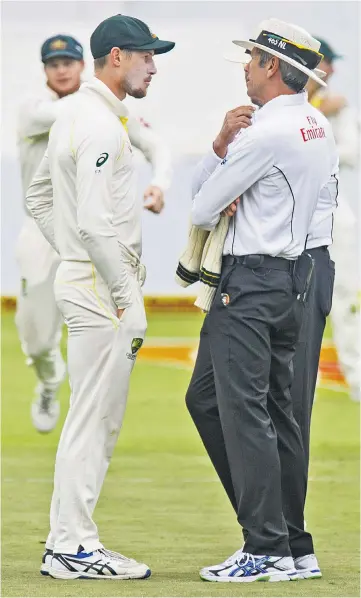  ??  ?? Caught out: Australia’s Cameron Bancroft is confronted by the umpires over ball-tampering in the third Test against South Africa