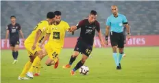  ?? Courtesy: AGC ?? Al Wahda and Al Wasl players vie for the ball during the Arabian ■ Gulf Cup clash at Zayed Sports City Stadium yesterday.
