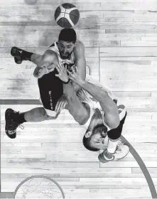  ?? Harry How / Getty Images ?? Team USA’s Joe Harris, left, challenges Spain’s Marc Gasol as Gasol puts up a shot in Friday’s exhibition game won by the U.S. 90-81.