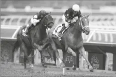  ?? JAE C. HONG/AP ?? VICTOR ESPINOZA RIDES CE CE (right) to victory past Joel Rosario, riding Edgeway, during the Breeders’ Cup Filly & Mare Sprint race at Del Mar in Del Mar, Calif. on Saturday.