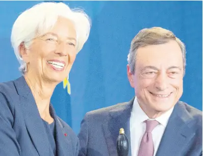  ?? AP ?? Outgoing European Central Bank (ECB) President Mario Draghi shakes hands with his designated successor, Christine Lagarde, at a ceremony celebratin­g the change at the head of the ECB in Frankfurt, Germany, Monday, October 28, 2019.