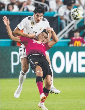  ?? Picture: AFP ?? REAL TOUGH: Real Madrid’s Jesus Vallejo tangles with Manchester United’s Alexis Sanchez during the Internatio­nal Champions Cup match at Hard Rock Stadium in Miami.