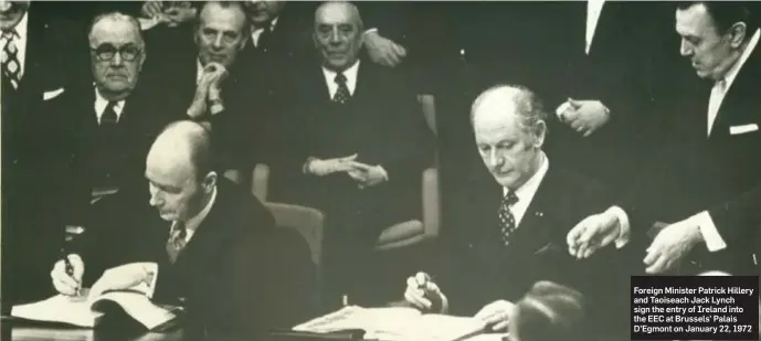  ??  ?? Foreign Minister Patrick Hillery and Taoiseach Jack Lynch sign the entry of Ireland into the EEC at Brussels’ Palais D’Egmont on January 22, 1972